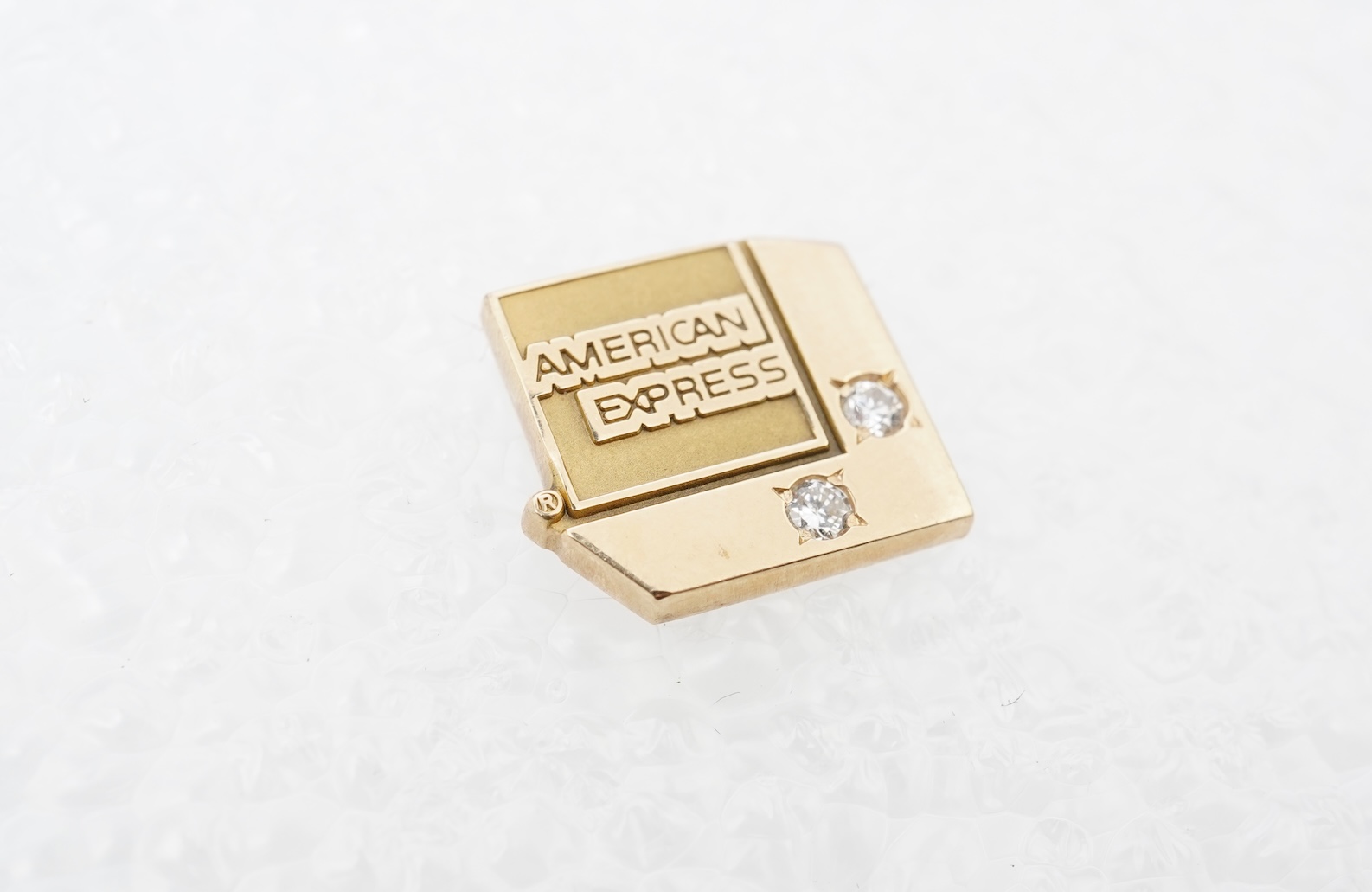 A gold and diamond novelty pin